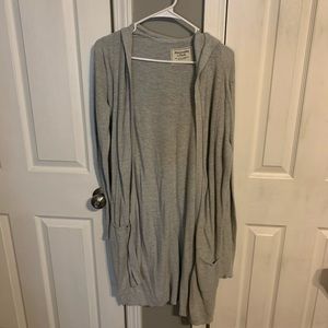 long grey hooded sweater.